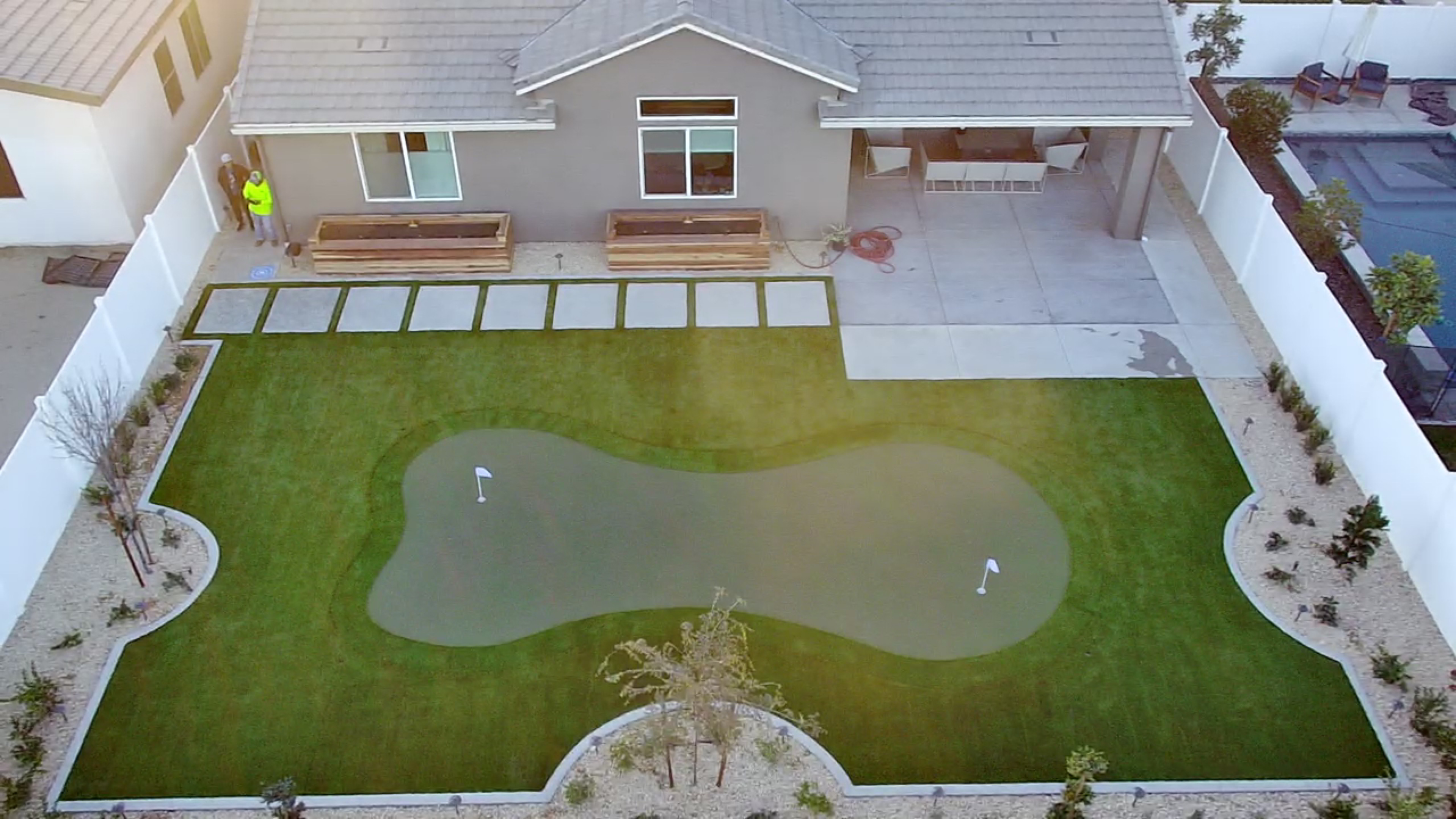 Custom putting green with artificial turf aerial view